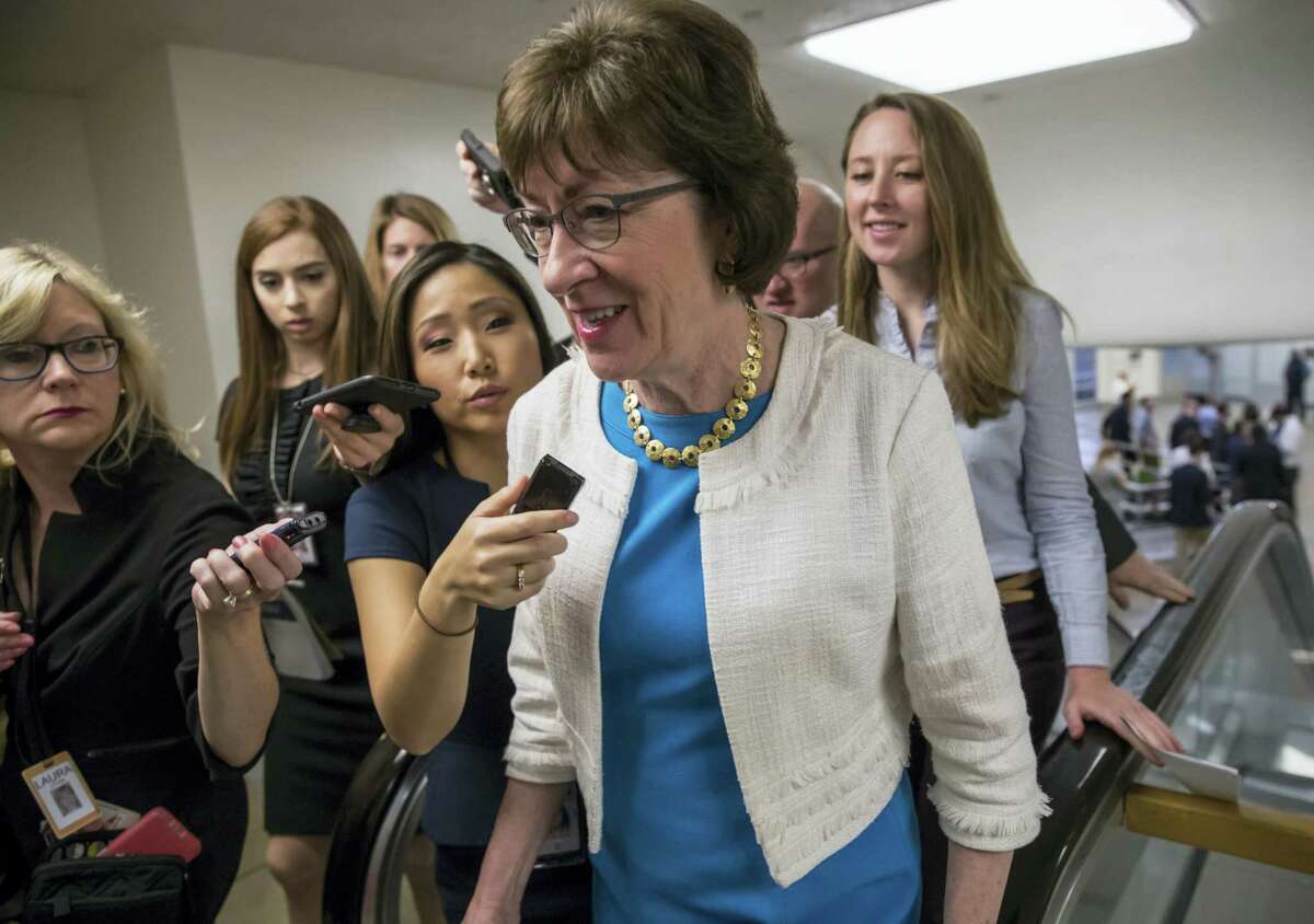 Sen. Susan Collins, R-Maine is surrounded by reporters as she heads to the Senate on Capitol Hill in Washington, Thursday while the Republican majority in Congress remains stymied by their inability to fulfill their political promise to repeal and replace “Obamacare” because of opposition and wavering within the GOP ranks.