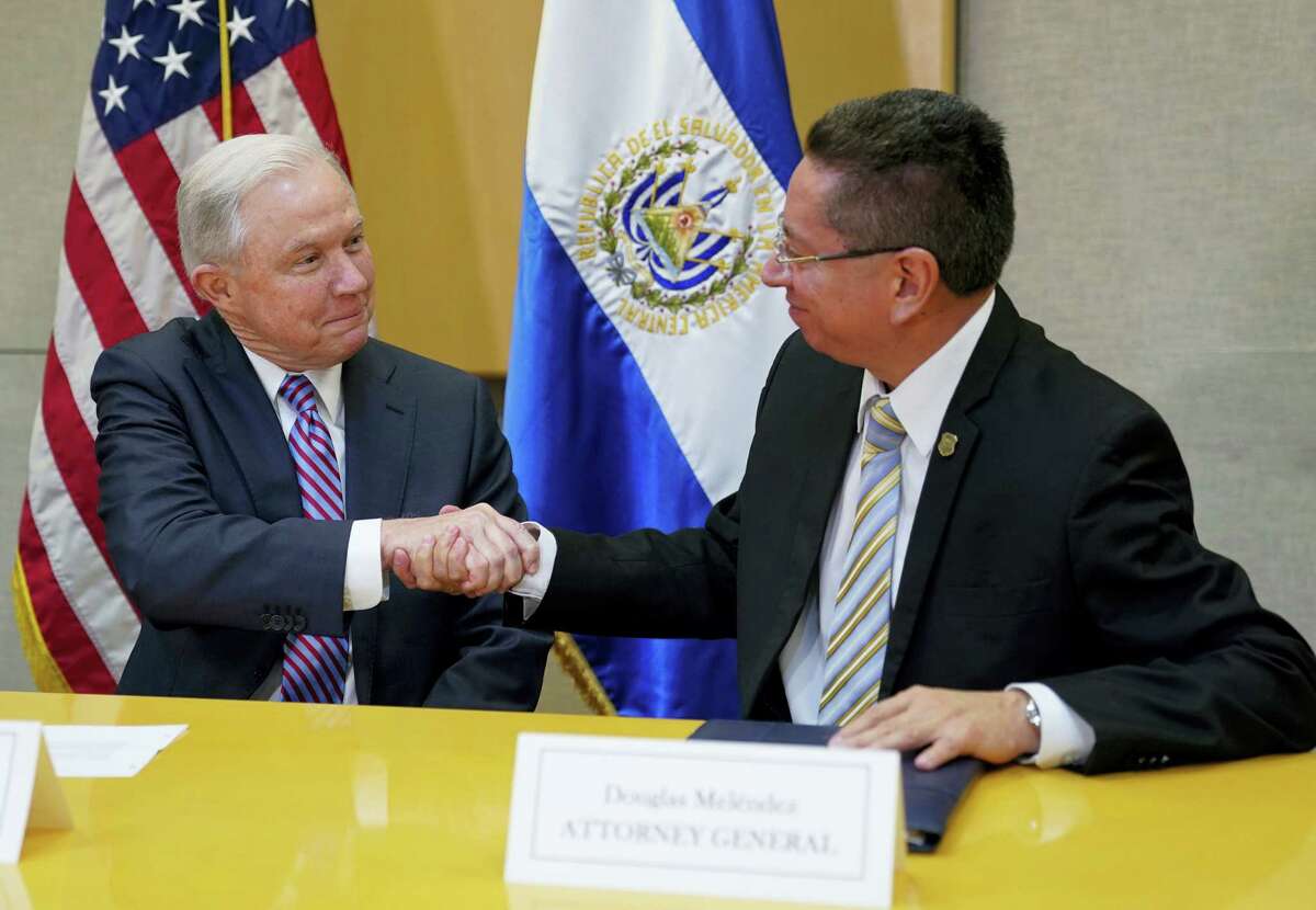 U.S. Attorney General Jeff Sessions shakes hands with El Salvador Attorney General Douglas Melendez Ruiz during their meeting in San Salvador, El Salvador, Thursday, July 27, 2017.