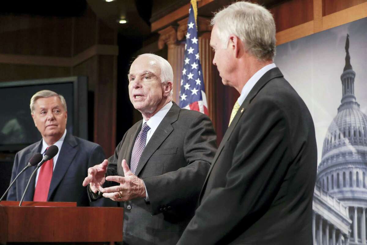 Sen. John McCain, R-Ariz., flanked by Sen. Lindsey Graham, R-S.C., left, and Sen. Ron Johnson, R-Wis., speaks to reporters at the Capitol as the Republican-controlled Senate unable to fulfill their political promise to repeal and replace “Obamacare” because of opposition and wavering within the GOP ranks, in Washington, Thursday, July 27, 2017. McCain returned to Capitol Hill after being diagnosed with an aggressive type of brain cancer recently.