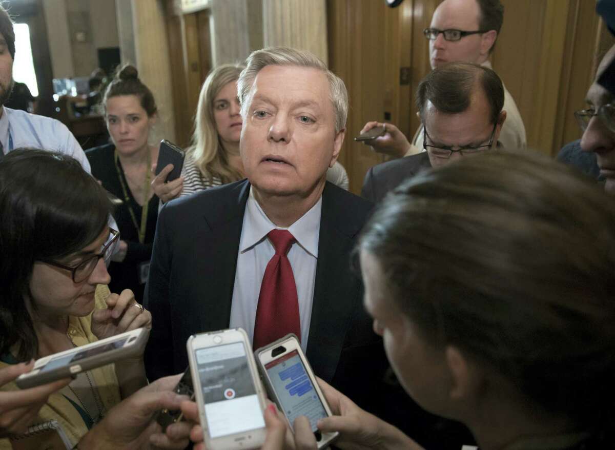 Sen. Lindsey Graham, R-S.C. is surrounded by reporters as he arrives at the Senate chamber on Capitol Hill in Washington, Thursday, July 27, 2017, as the Republican majority in Congress remains stymied by their inability to fulfill their political promise to repeal and replace “Obamacare.”