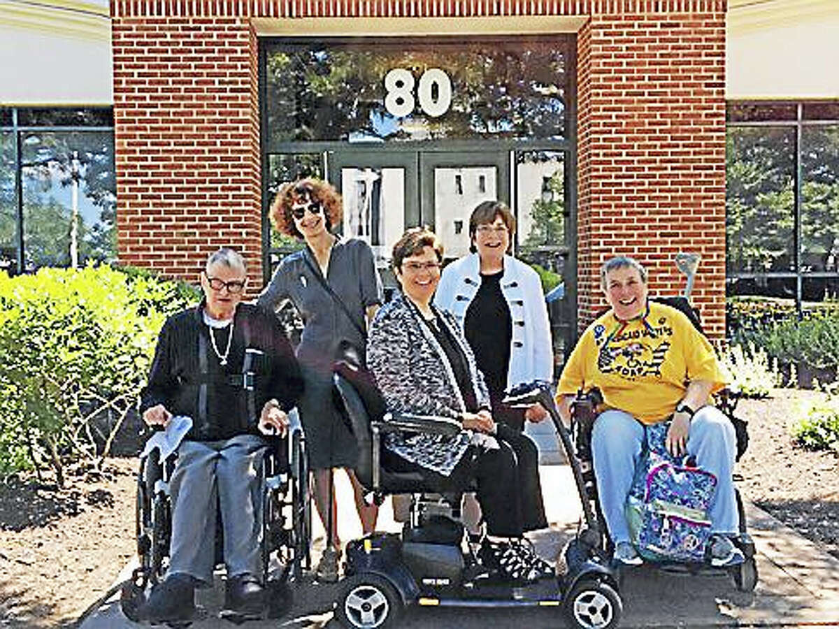 “The Capitol Five”: Gary Gross, Elanah Sherman, Melissa Marshall, Molly Cole, and Elaine Kolb line up outside Community Court.