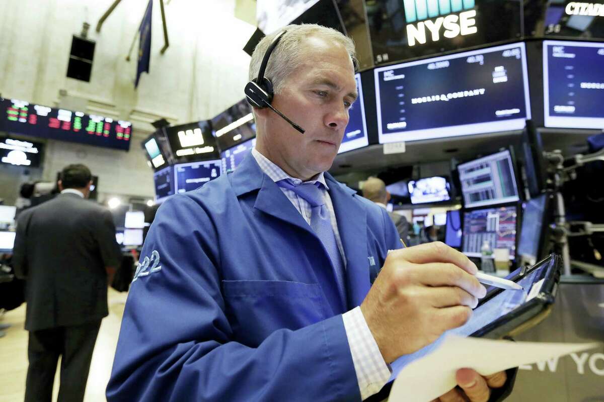Trader Timothy Nick works on the floor of the New York Stock Exchange Monday.