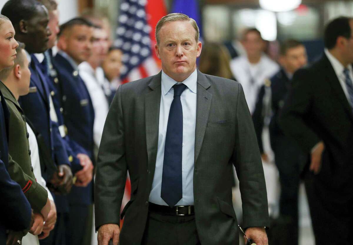White House press secretary Sean Spicer walks down the hallway during President Donald Trump’s visit to the Pentagon, Thursday, July 20, 2017. White House Press Secretary Sean Spicer has resigned over hiring of new communications aide.