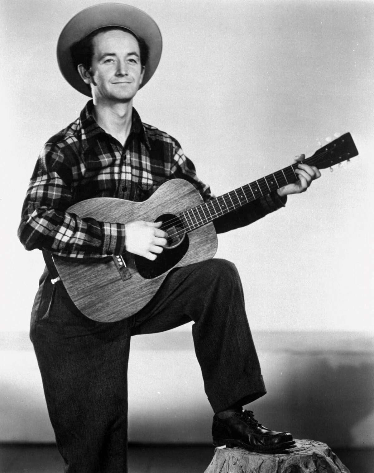 Guthrie, pictured in 1947, penned several songs tackling racism, including one aimed at President Donald Trump's father.