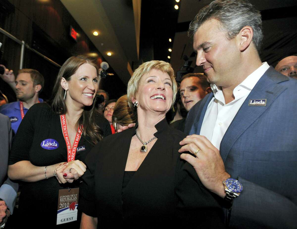 In this May 21, 2010 photo, Shane McMahon, right joins his mother, Republican candidate for U.S. Senate Linda McMahon, center, and his sister Stephanie, at the Connecticut Republican Convention in Hartford, Conn. On Wednesday, July 19, 2017, a helicopter with Shane McMahon aboard made an emergency landing in the ocean off New York’s Long Island. McMahon and the pilot were uninjured in the incident.