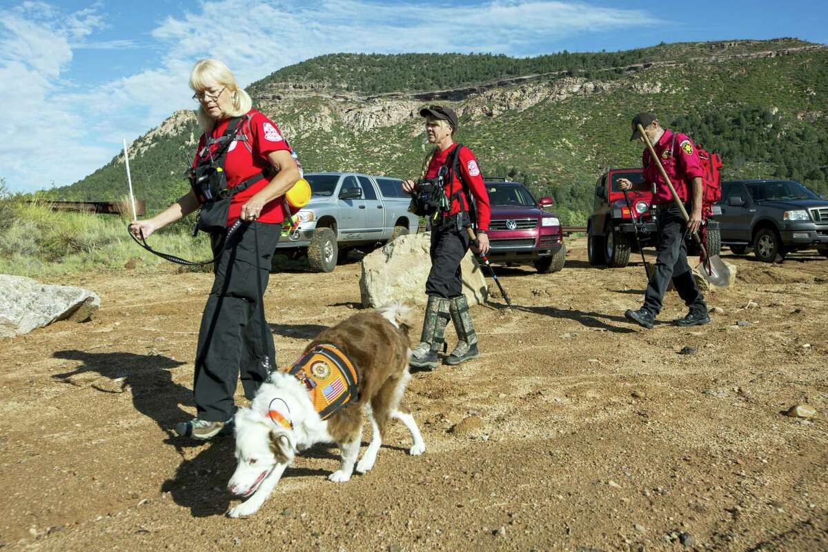 Volunteer rescuers from Navajo County begin searching for a missing 27-year-old man in Tonto National Forest, Ariz., Monday, July 17, 2017. The man was swept downriver with more than a dozen others when floodwaters inundated the area on Saturday.