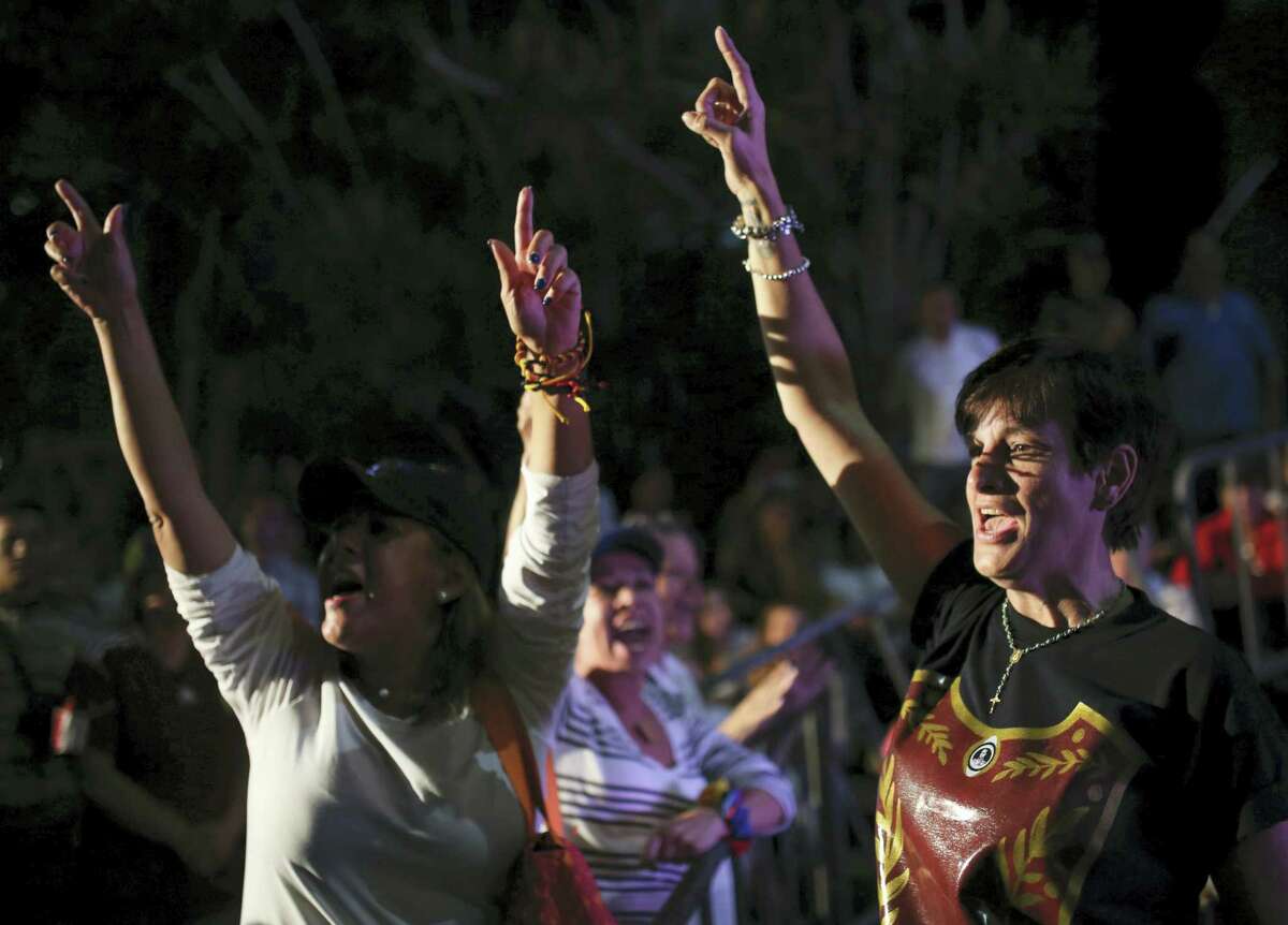 Opposition members shout slogans against Venezuela’s President Nicolas Maduro as they waits for the results of a of a symbolic referendum in Caracas, Venezuela, Sunday, July 16, 2017. Hundreds of thousands of Venezuelans lined up across the country and in expatriate communities around the world Sunday to vote in a symbolic rejection of President Maduro’s plan to rewrite the constitution, a proposal that’s raising tensions in a nation battered by shortages and anti-government protests.