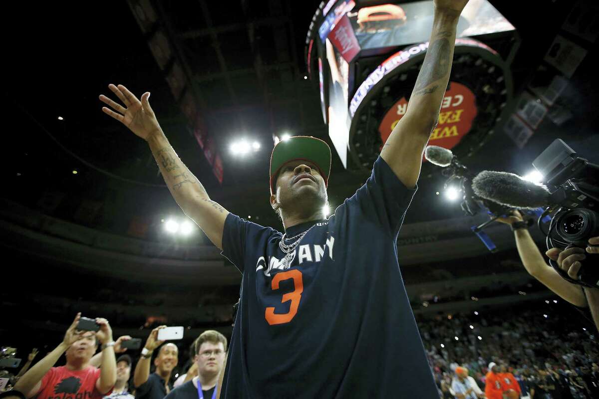 Allen Iverson acknowledges the hometown fans during his introduction in Philadelphia, Pa., on Sunday.