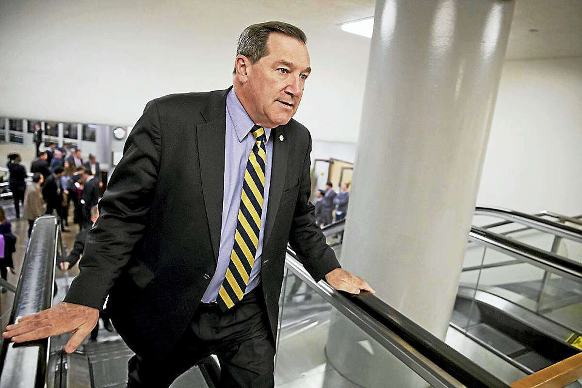 In this April 7, 2017, file photo, U.S. Sen. Joe Donnelly, D-Ind., arrives for the confirmation vote for Supreme Court nominee, Neil Gorsuch, on Capitol Hill in Washington. Donnelly railed against Carrier Corp. for moving manufacturing jobs to Mexico last year, even while he profited from a family business that relies on Mexican labor to produce dye for ink pads, according to records reviewed by The Associated Press.