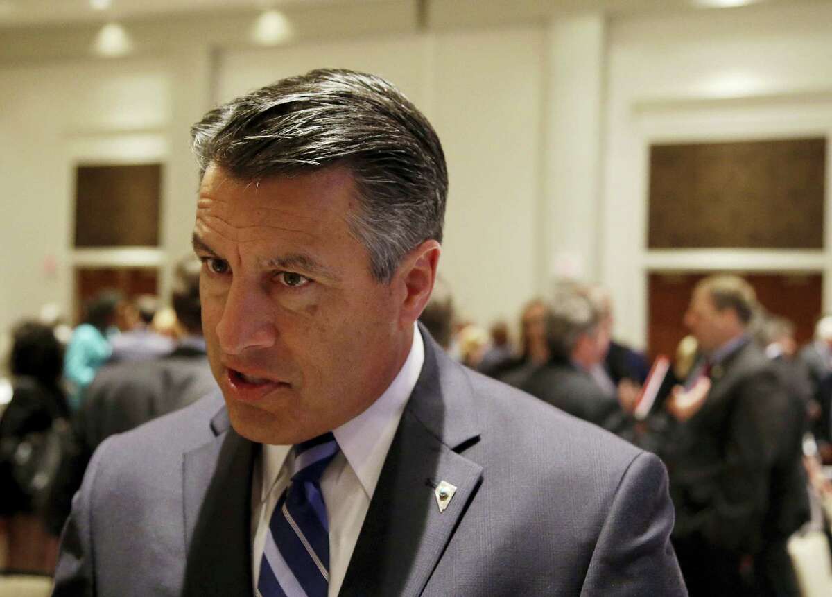 Nevada Republican Gov. Brian Sandoval responds to reporter’s questions about health care and the opioid epidemic after a session called “Curbing The Opioid Epidemic” at the first day of the National Governor’s Association meeting Thursday, July 13, 2017, in Providence, R.I.