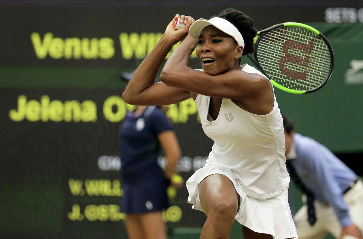 Venus Williams returns to Jelena Ostapenko during their women’s quarterfinal match at Wimbledon on Tuesday.