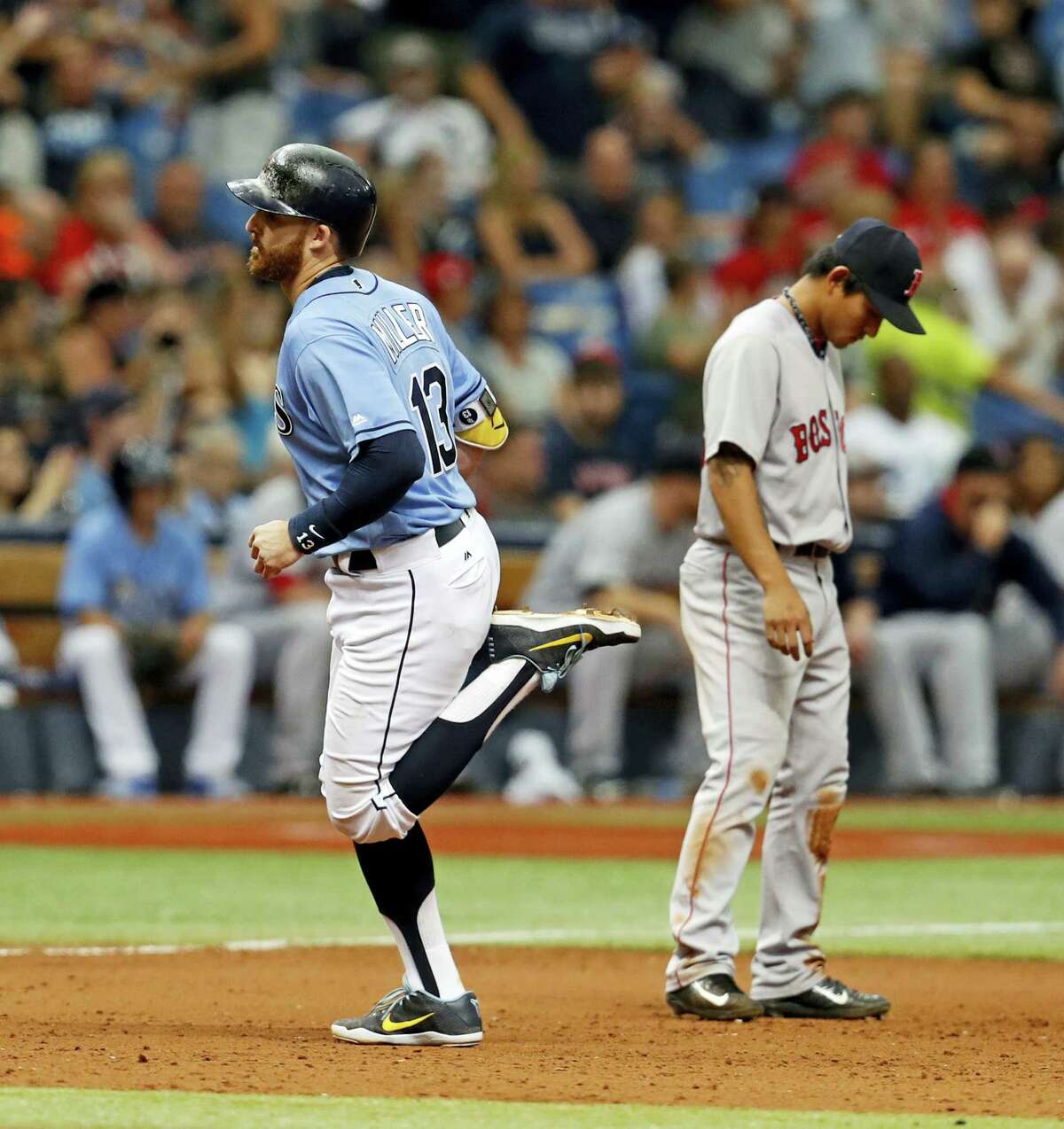 The Rays’ Brad Miller rounds the bases after his two-run home run.