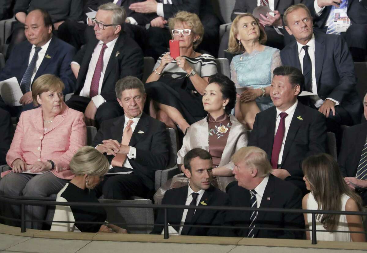 Leaders, including German Chancellor Angela Merkel, left, and their partners attend a concert at the Elbphilharmonie concert hall on the first day of the G-20 summit in Hamburg, northern Germany, Friday, July 7, 2017.