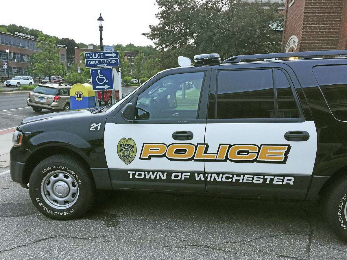 A Winchester police car outside of the department in Winsted.