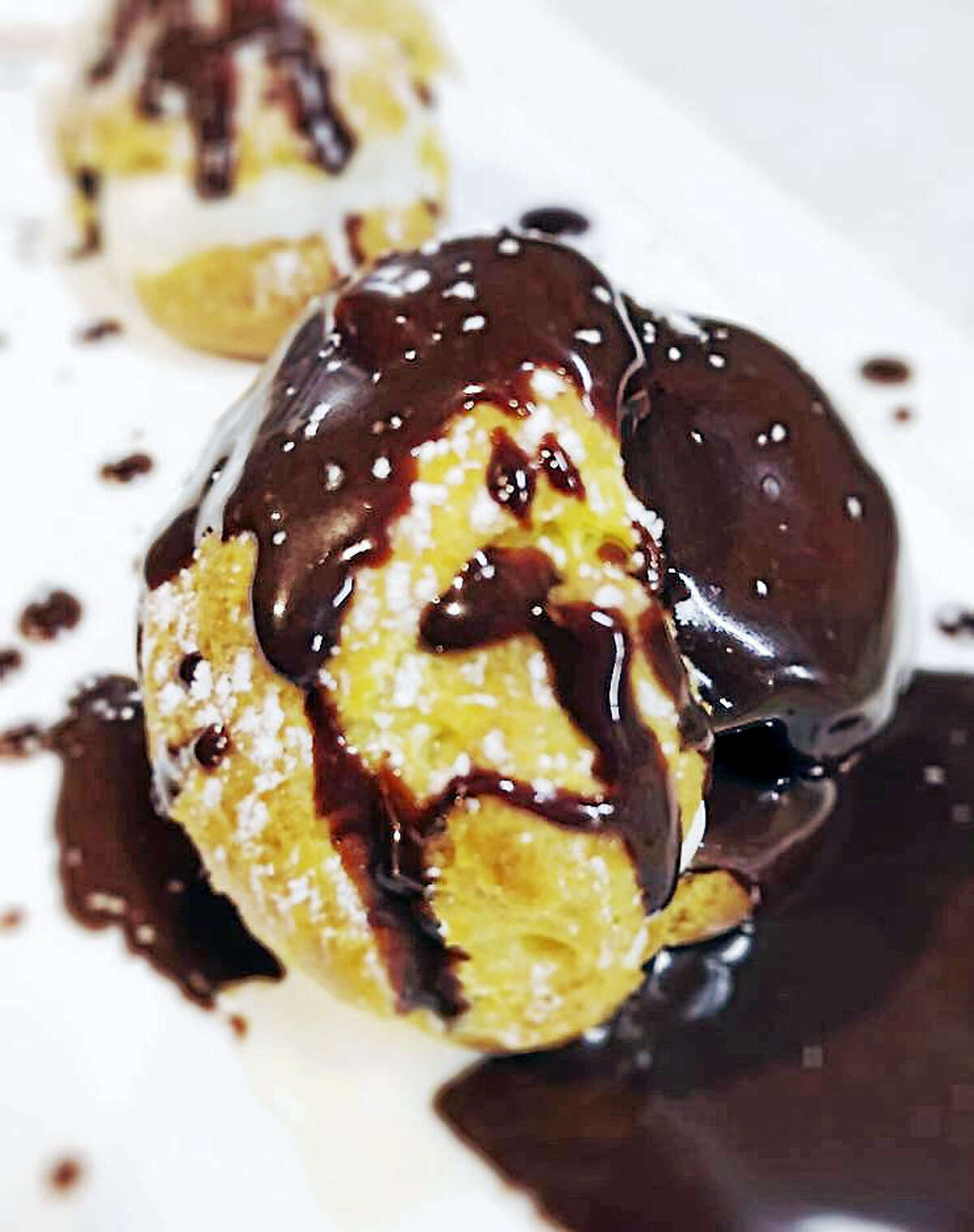 Contributed photoPetits Choux filled with house-made vanilla ice cream and warm chocolate sauce.