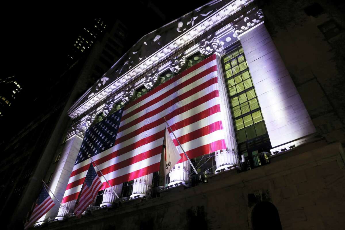An American flag hangs on the front of the New York Stock Exchange.