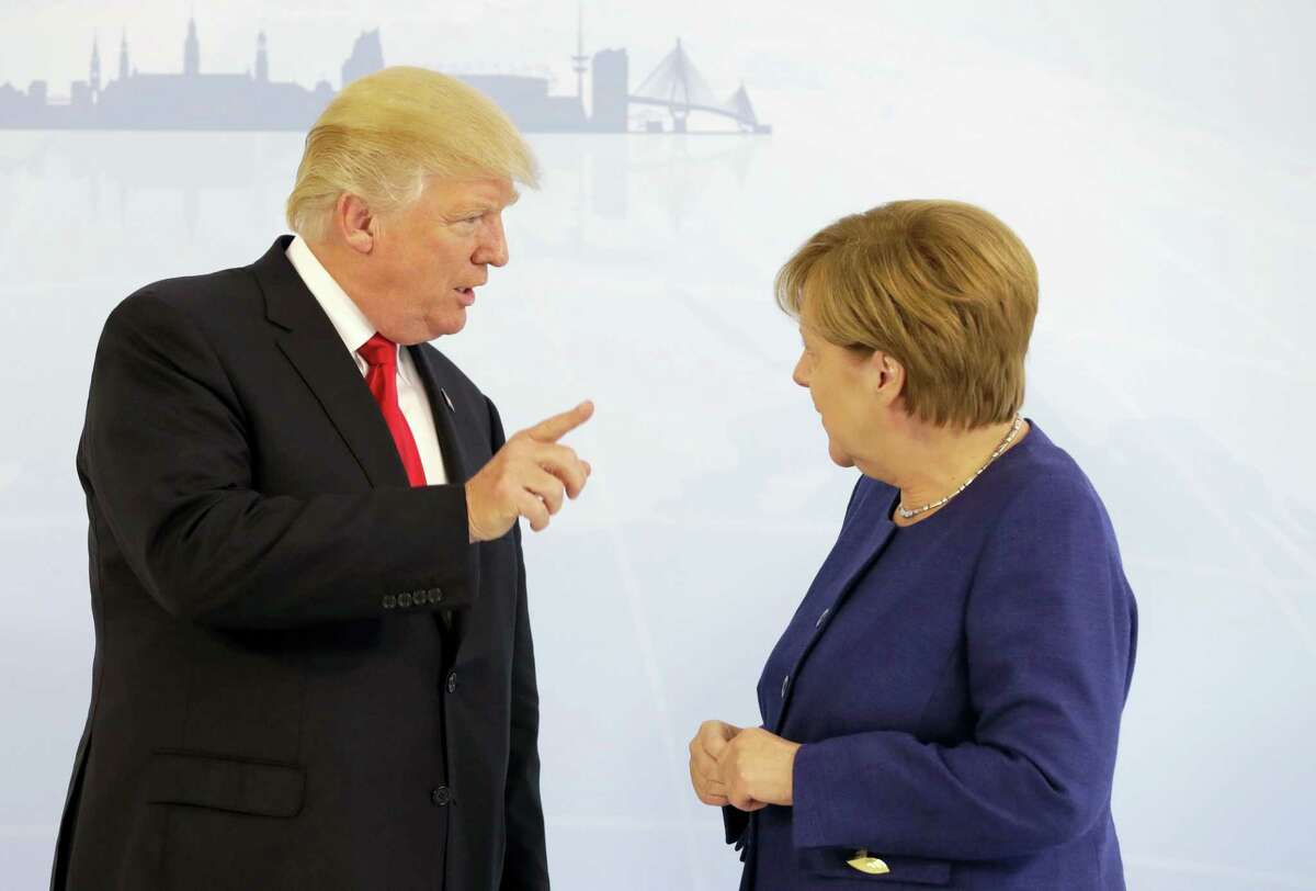 U.S. President Donald Trump, left, and German Chancellor Angela Merkel pose for a photograph prior to a bilateral meeting on the eve of the G-20 summit in Hamburg, northern Germany, Thursday, July 6, 2017. The leaders of the group of 20 meet July 7 and 8.