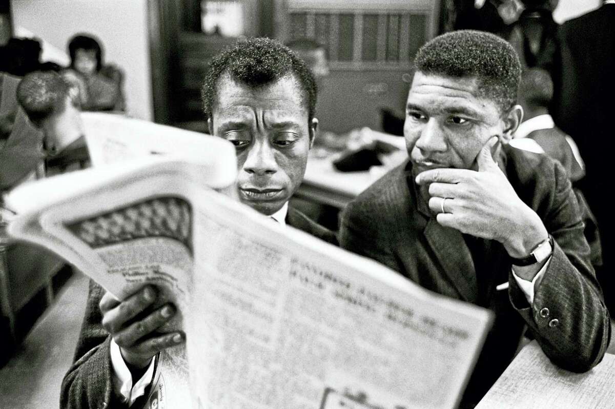 James Baldwin (left) in 1963 in Mississippi, where he visited the NAACP’s Medgar Evers.