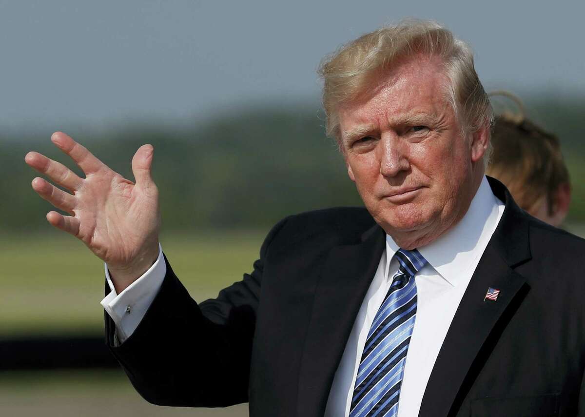 President Donald Trump waves as he arrive on Air Force One at Morristown Municipal Airport, in Morristown, N.J., Friday, June 30, 2017, en route to Trump National Golf Club in Bedminster, N.J.. The president is traveling with first lady Melania Trump, and their son Barron Trump.