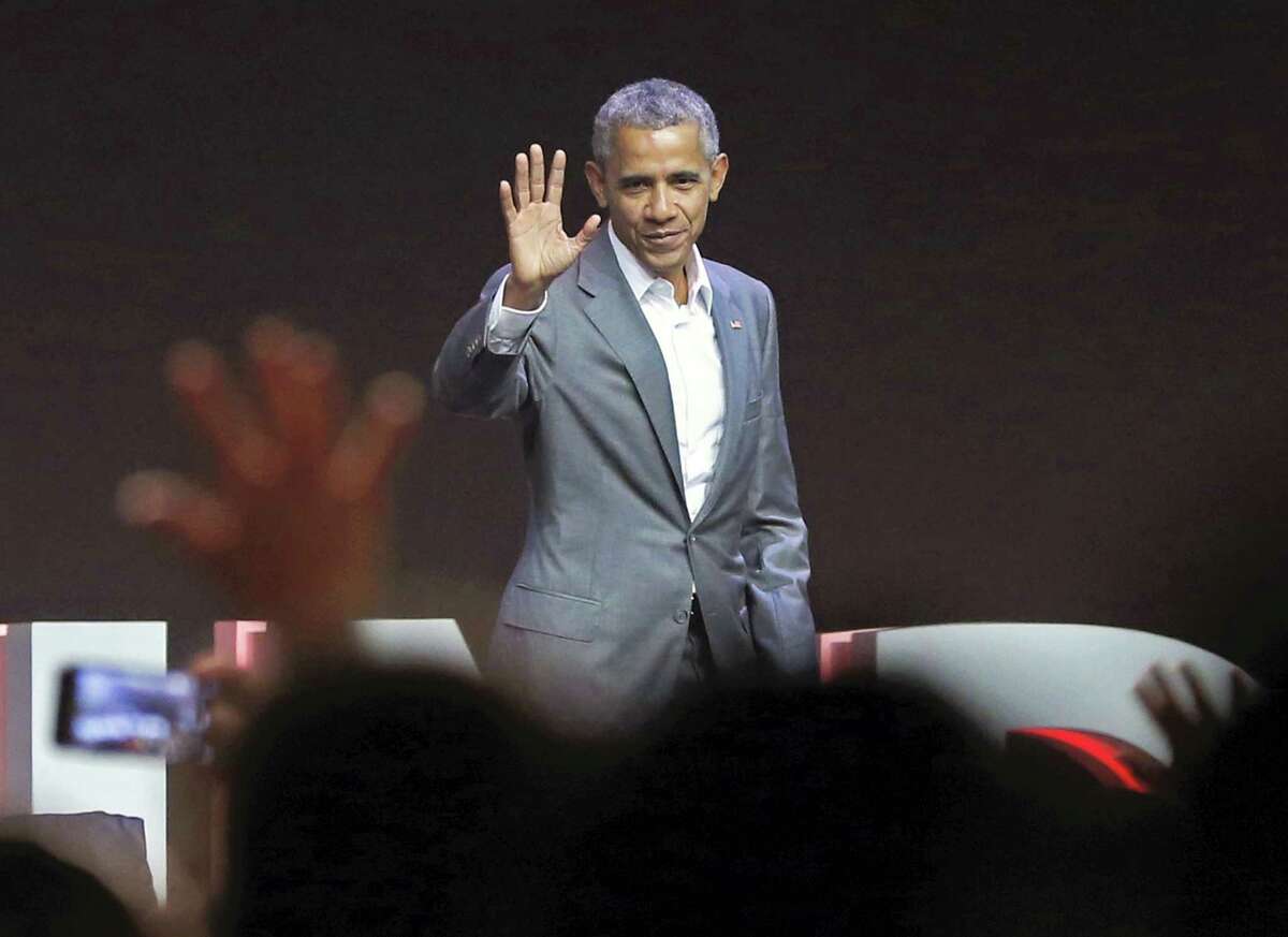 Former U.S. President Barack Obama waves at the audience after delivering his speech during the 4th Congress of the Indonesian Diasporas in Jakarta, Indonesia, Saturday, July 1, 2017.