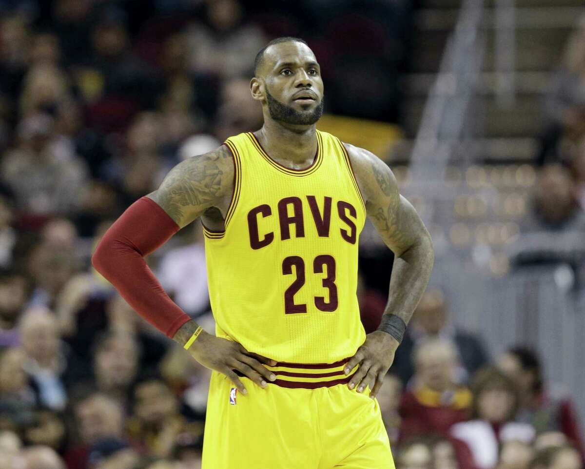 In this Jan. 25, 2017 photo, Cleveland Cavaliers’ LeBron James waits during a timeout in the first half of the team’s NBA basketball game against the Sacramento Kings in Cleveland. After James was criticized by Charles Barkley for questioning Cleveland’s front office, James tore into the former NBA star and opinionated TV commentator on Jan. 30, 2017 following a loss in Dallas.