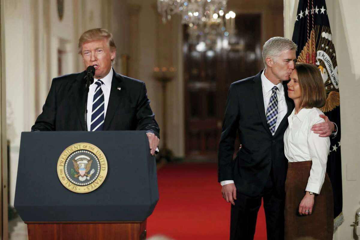 President Donald Trump speaks in the East Room of the White House in Washington, Tuesday, Jan. 31, 2017, to announce Judge Neil Gorsuch as his nominee for the Supreme Court. Gorsuch stands with his wife Louise. (AP Photo/Carolyn Kaster)