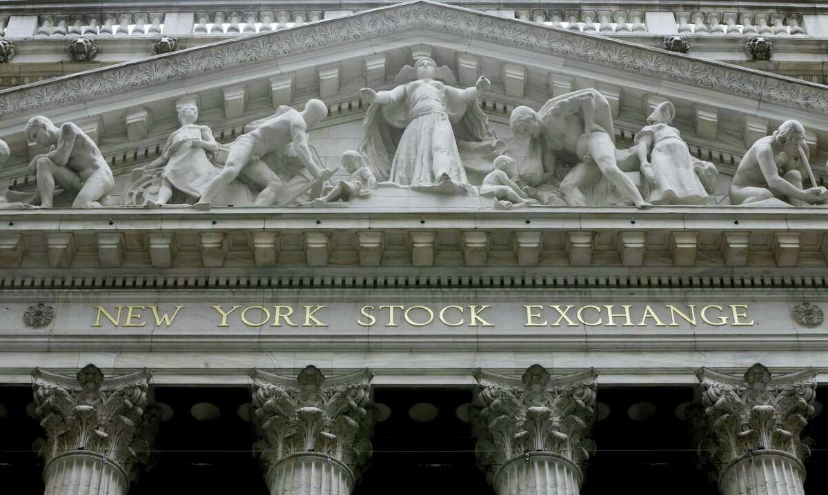FILE - This Thursday, Oct. 2, 2014, file photo, shows the facade of the New York Stock Exchange. European stock markets eked out some modest gains Tuesday, Jan. 31, 2017, after encouraging economic figures boosted hopes that the region's recovery is gathering pace.