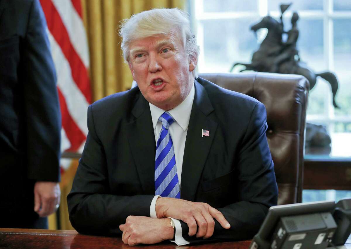 In this March 24, 2017, file photo President Donald Trump speaks in the Oval Office of the White House in Washington. Trump has been handing out his cellphone number to world leaders and urging them to call him directly, an unusual invitation that breaks diplomatic protocol and is raising concerns about the security and secrecy of the U.S. commander in chief’s communications.