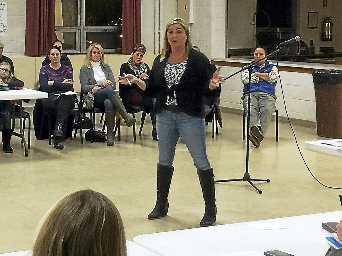 Ben Lambert - The Register Citizen Parents gathered to discuss concerns with the public schools and Board of Education Friday evening at the Litchfield Firehouse. Above, a parent speaks during the meeting.