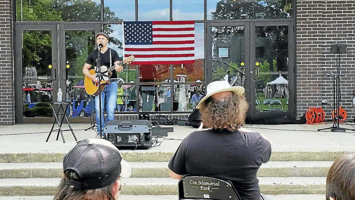Former state Rep. Brian Mattiello entertains the crowd singing cover songs at Coe Memorial Park at the first-ever Saturday in the Park event in Torrington on Saturday.