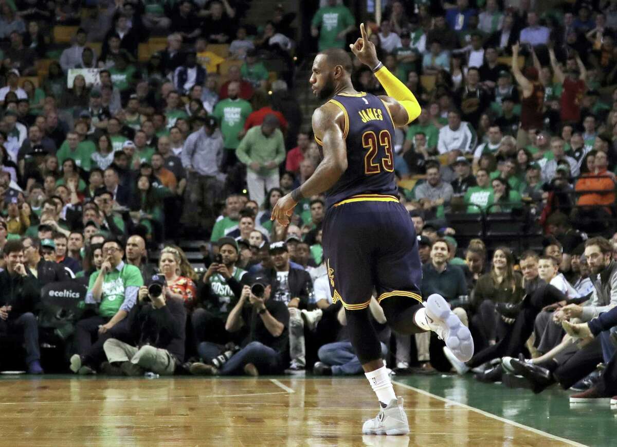 LeBron James celebrates after sinking a 3-pointer in the Eastern Conference finals.