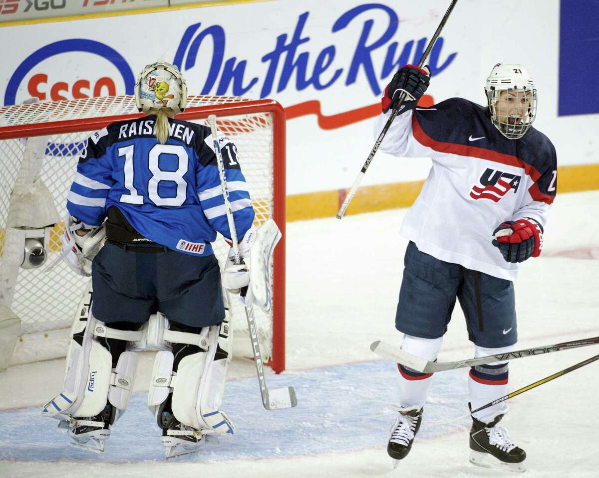 In this March 29, 2016 photo, United States’ Hilary Knight celebrates after scoring against Finland goaltender Meeri Raisanen during a women’s world hockey championships game in Kamloops, British Columbia. The U.S. women’s national team says discussions with USA Hockey over an ongoing wage dispute were productive and will continue this week. The team released a statement March 20, after a lengthy meeting that included almost 20 players and top executives from USA Hockey. Players announced last week they’d boycott the upcoming world championships in Plymouth, Michigan unless significant progress was made toward a labor agreement.
