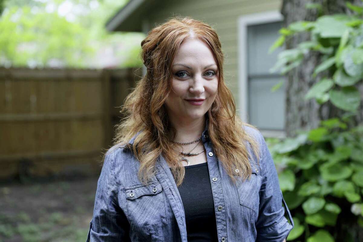In this May 23, 2017, photo, Dawn Erin poses for a photo at her home, in Austin, Texas. Erin was among more than 20 million Americans who gained coverage under Affordable Care Act. The health law helped push uninsured rates to historic lows and also aimed to bring the newly insured back into the primary care system to improve their health.