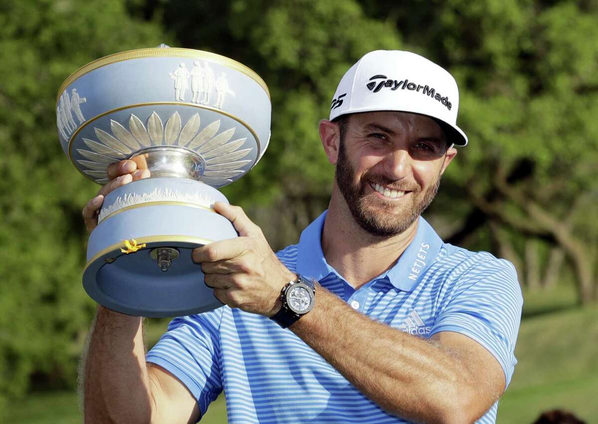 Dustin Johnson holds his trophy after defeating Jon Rahm at the Dell Technologies Match Play tournament Sunday in Austin, Texas.