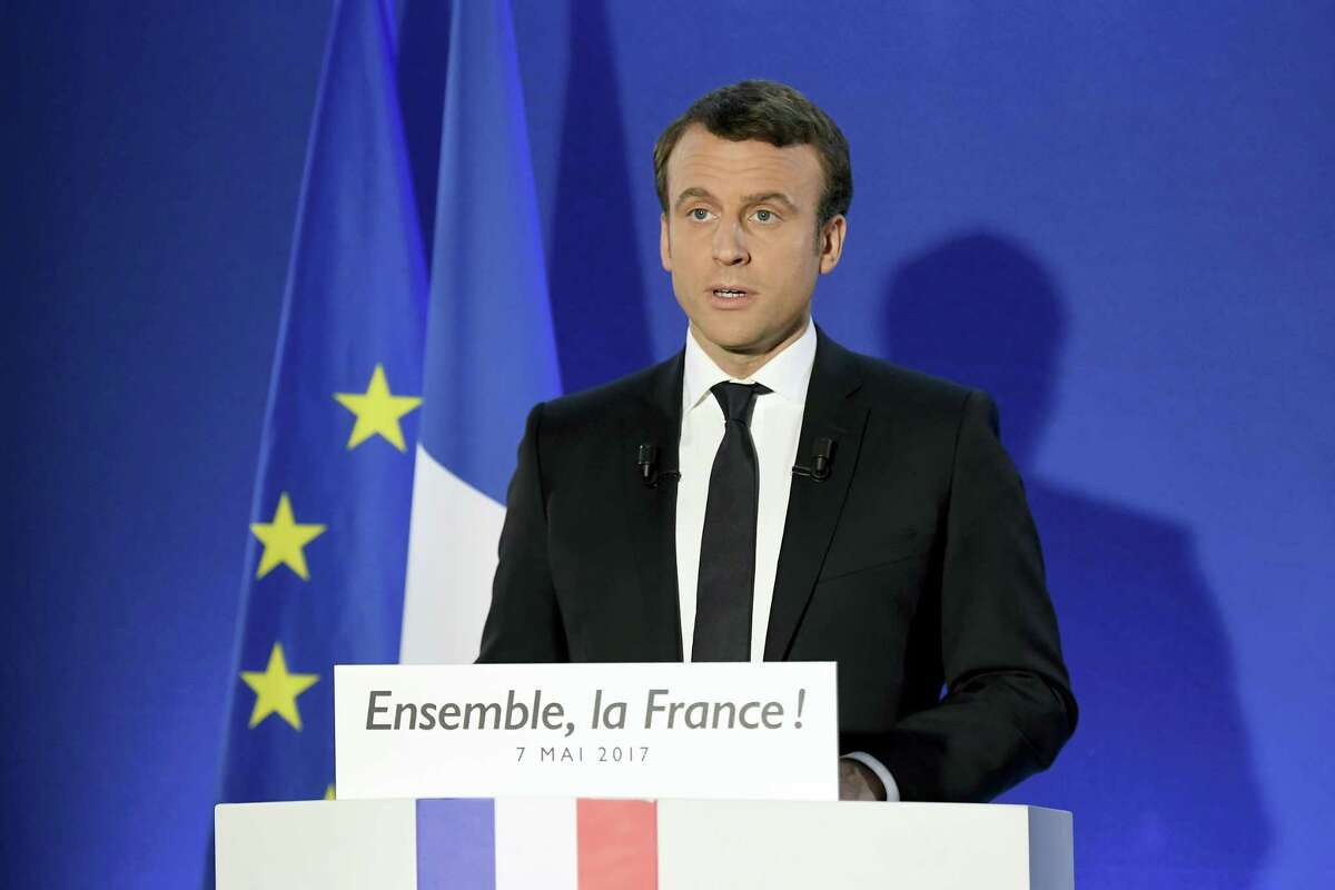 Incoming French president Emmanuel Macron speaks after his victory in presidential runoff, at his campaign headquarters in Paris, Sunday, May 7, 2017. French voters elected centrist Emmanuel Macron as the country's youngest president ever on Sunday, delivering a resounding victory to the unabashedly pro-European former investment banker and strengthening France's place as a central pillar of the European Union. (Lionel Bonaventure/Pool Photo via AP)