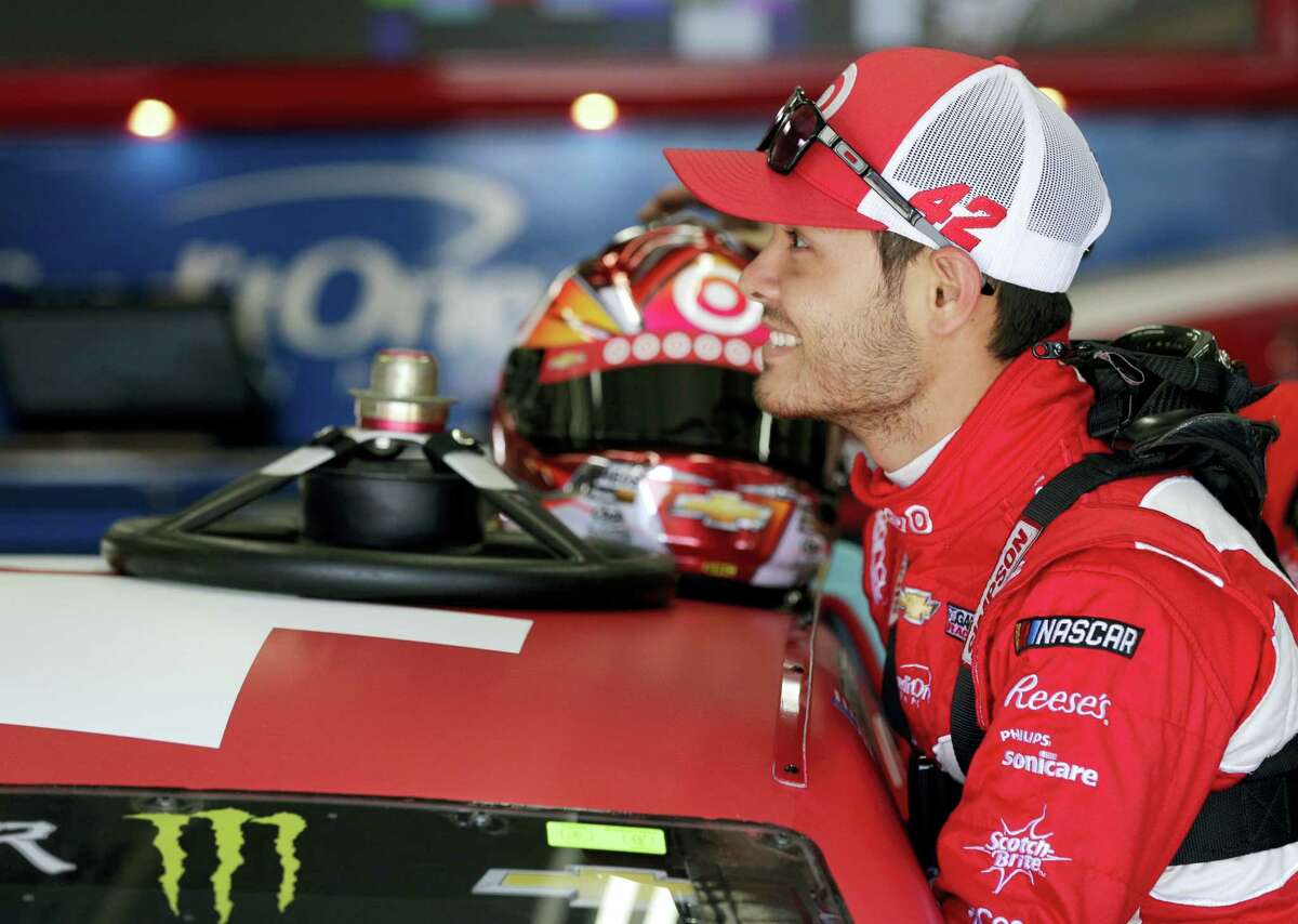 Kyle Larson smiles as he climbs into his car before a recent practice.