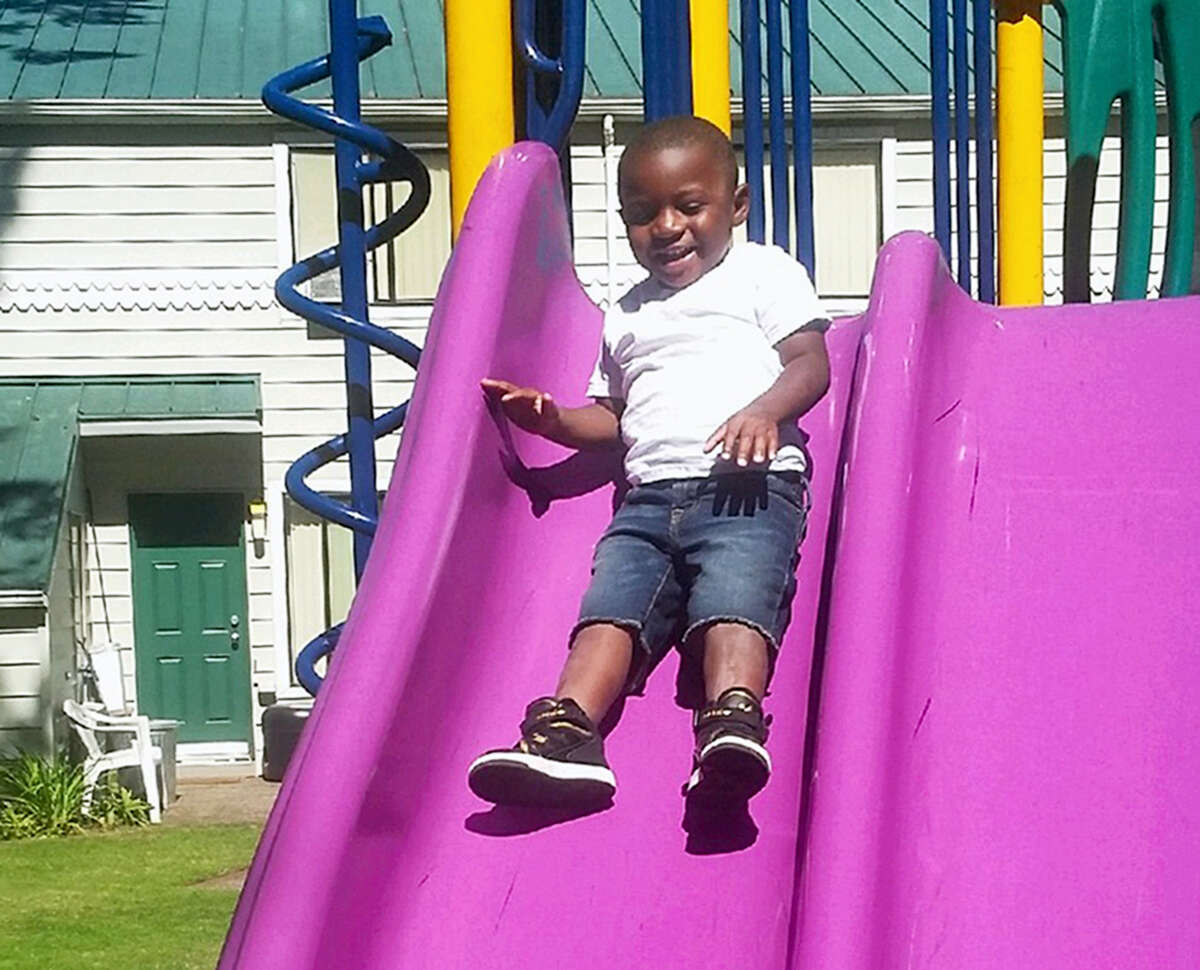 This July 2016 photo provided by Pamela Harris shows Reginald Kendall Harris Jr., playing on a slide at a park in Portland, Ore. Reginald died after swallowing methadone. His uncle has been charged in his death, accused of leaving the methadone where the boy had access to it. The number of children’s deaths is still small relative to the overall toll from opioids, but toddler fatalities have climbed steadily over the last 10 years.