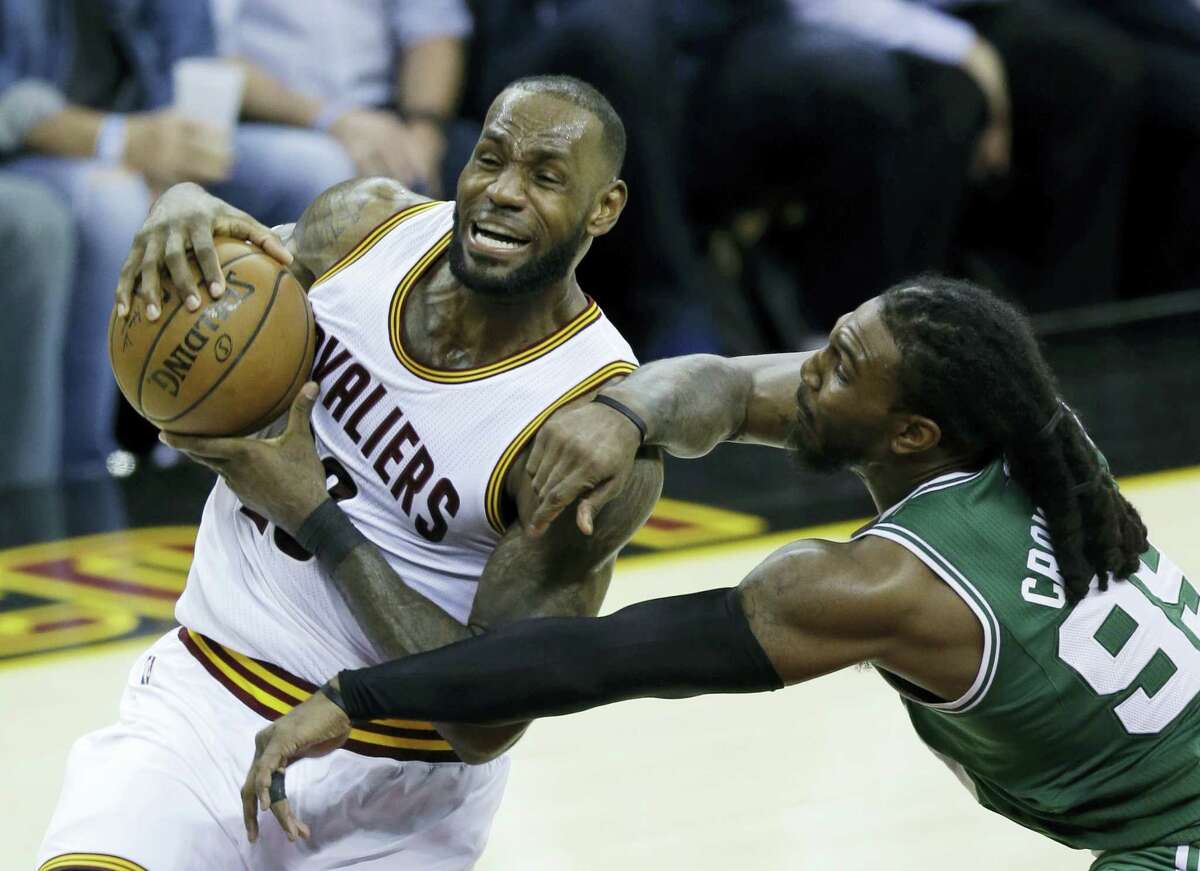 Cleveland Cavaliers’ LeBron James (23) goes up for a shot against Boston Celtics’ Jae Crowder (99) during the second half of Game 4 of the NBA basketball Eastern Conference finals, Tuesday, in Cleveland. The Cavaliers won 112-99.
