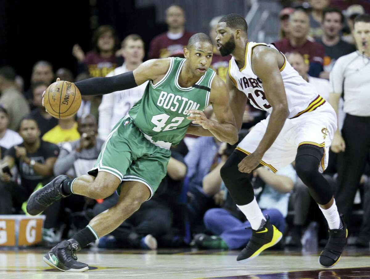 Boston Celtics’ Al Horford (42) drives on Cleveland Cavaliers’ Tristan Thompson (13) during the second half of Game 4 of the NBA basketball Eastern Conference finals, Tuesday, in Cleveland.