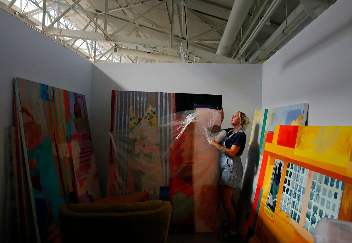 Second year MFA and MA student Jordan Holms moves her artwork and supplies into her new studio space after spending the entire day moving it into San Francisco Art Institute's new campus inside the remodeled historic Herbst Pavilion at the Fort Mason Center for Arts & Culture August 22, 2017 in San Francisco, Calif.