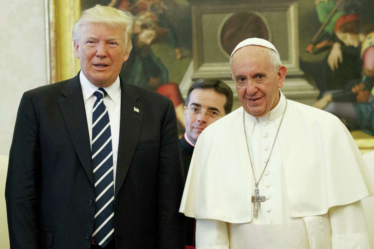 U.S. President Donald Trump stands with Pope Francis during a meeting, Wednesday, May 24, 2017, at the Vatican.
