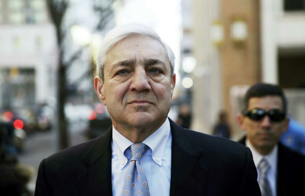 Former Penn State president Graham Spanier walks to the Dauphin County Courthouse in Harrisburg, Pa., on March 20, 2017. Spanier faces charges that he failed to report suspected child sex abuse in the last remaining criminal case in the Jerry Sandusky child molestation scandal.