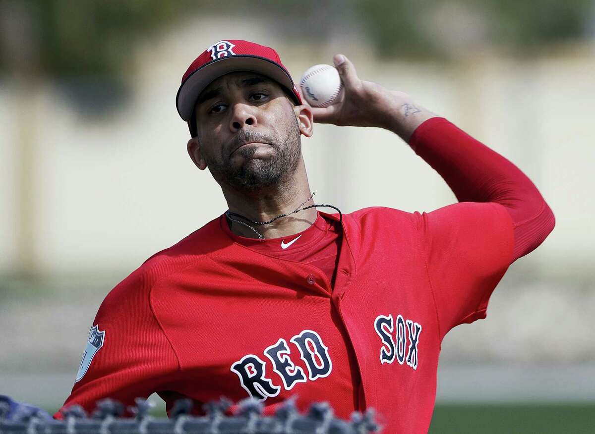 FILE - In this Feb. 19, 2017, file photo, Boston Red Sox pitcher David Price throws a live batting session at a spring training baseball workout in Fort Myers, Fla. Price is likely to start the season on the disabled list because of his sore pitching elbow. Starting the second season of a $217 million, seven-year contract, Price has not yet appeared in an exhibition game. (AP Photo/David Goldman, File)