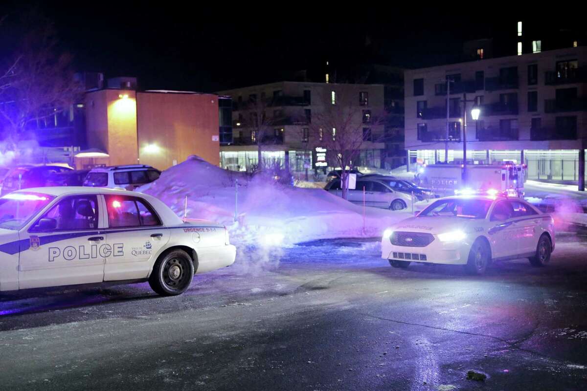 Police survey the scene after deadly shooting at a mosque in Quebec City, Canada, Sunday, Jan. 29, 2017. Quebec Premier Philippe Couillard termed the act “barbaric violence” and expressed solidarity with victims’ families. (Francis Vachon/The Canadian Press via AP)