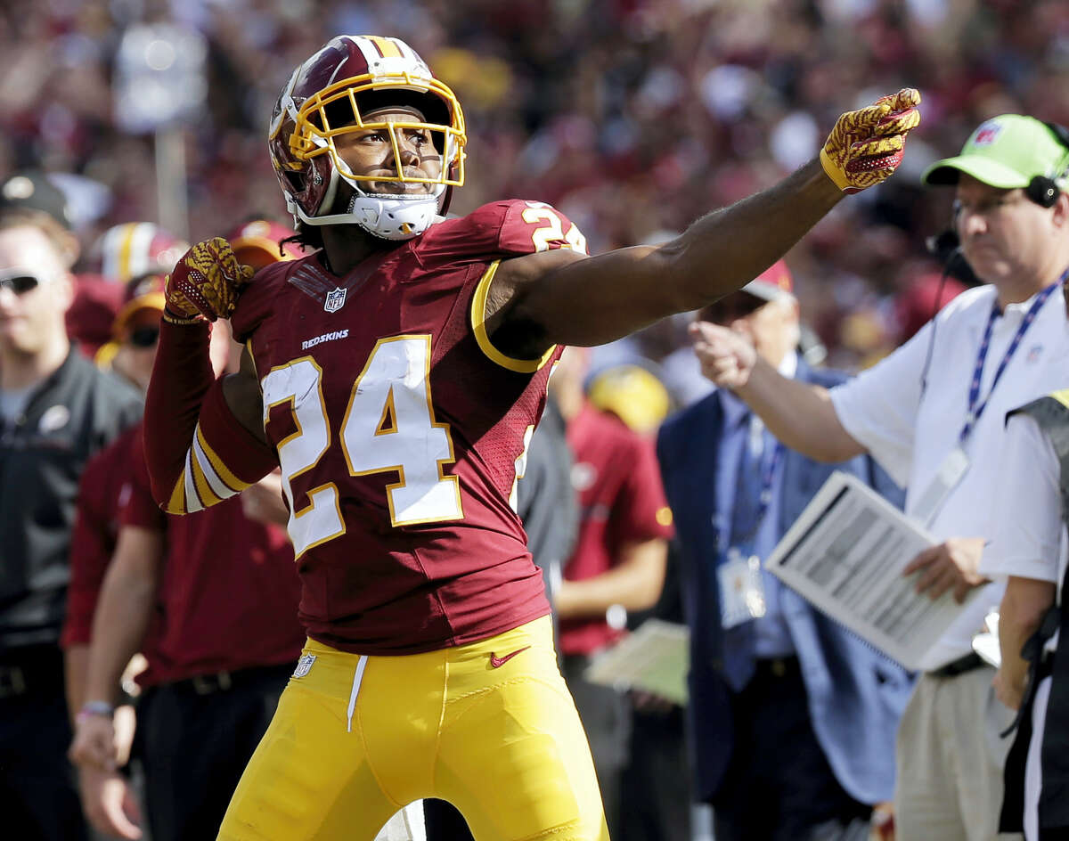 In this Oct. 2, 2016 photo, Washington Redskins cornerback Josh Norman (24) celebrates his interception with a “bow and arrow,” gesture during the second half of an NFL football game against the Cleveland Browns in Landover, Md. The NFL wants to put some flair back into celebrations. The league, however, will continue to penalize any celebration deemed offensive, including those that embarrass opponents or mimic the use of weapons.