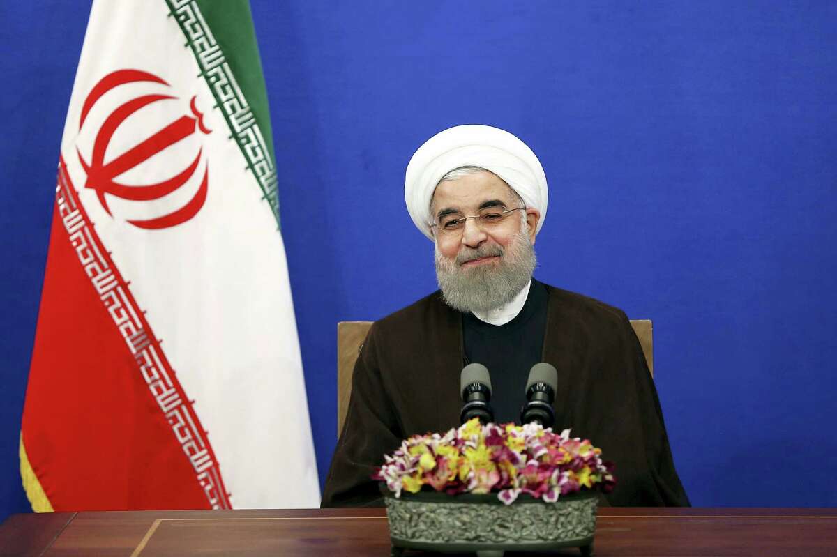 Iranian President Hassan Rouhani attends a televised speech after he won the election, in Tehran, Iran.