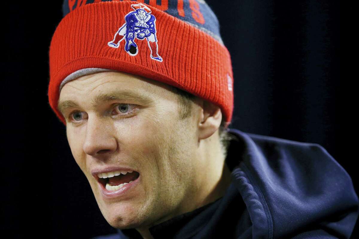 Patriots quarterback Tom Brady responds to a reporter’s question during a media availability Friday in Foxborough, Mass.