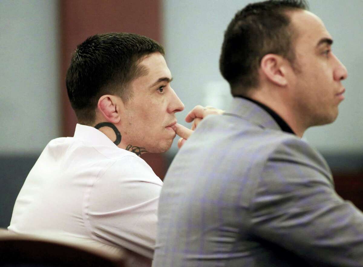 Former mixed martial arts fighter War Machine, also known as Jonathan Koppenhaver, left, listens to testimony.