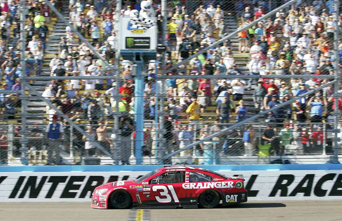 Ryan Newman takes the checkered flag to win Sunday’s race at Phoenix International Raceway.