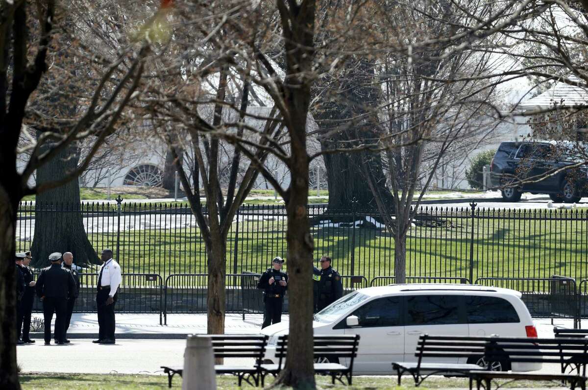 US Secret Service officers stand in the cordoned off area on Pennsylvania Avenue after a security incident near the fence of the White House in Washington, Saturday, March 18, 2017. President Trump was not at the White House at the time of the incident.
